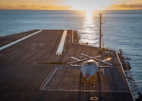 A Boeing unmanned MQ-25 aircraft sits on the flight deck aboard the aircraft carrier USS George H.W. Bush (CVN 77).