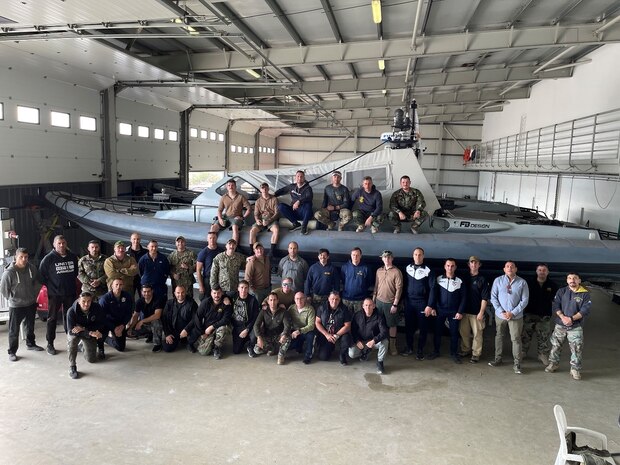 (Dec. 12, 2021) U.S. Navy divers, assigned to Construction Dive Detachment ALFA (CDD/A), a detachment of Underwater Construction Team (UCT) ONE, pose for a group photo during joint dive training and exchange with the Cypriot National Guard, Cyprus Navy, Cyprus National Police, and Cyprus Fire Service personnel, Dec. 12, 2021. The training and exchange covers dive operations, dive medicine, underwater search techniques, and rescue operations. The UCT CDDs are specially trained and equipped units within the Navy Expeditionary Combat Force that construct, inspect, repair and maintain ports, ocean facilities, underwater systems and general maritime infrastructure.