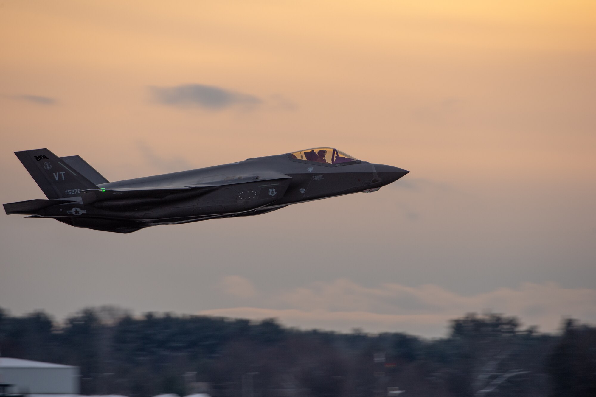 Col. Nathan "Wiz" Graber, previous commander of the 158th Operations Group, 158th Fighter Wing, flies by in an F-35A Lightning II during his final flight as a fighter pilot in the U.S. Air Force.