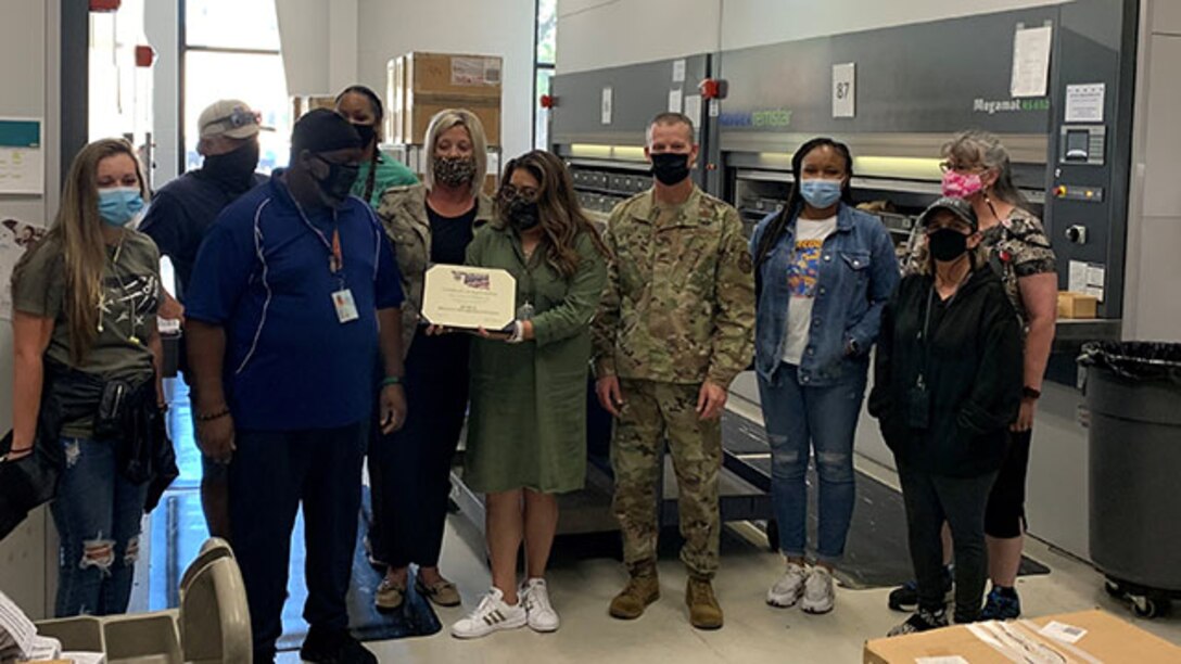 Air Force Col. Jason Kalin recognizes employees in the MKK  Shop Service Center Sept. 16, 2021.
