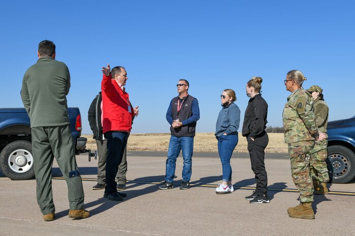 Anthony Bunch, 97th Operations Support Squadron airfield manager, shows potential emergency sites to members of the Federal Emergency Management Agency (FEMA) on Altus Air Force Base, Oklahoma, Dec. 16, 2021. Every three years, FEMA evaluates regional staging locations in case they need to establish operations in a disaster-stricken region. (U.S. Air Force photo by Airman 1st Class Trenton Jancze)