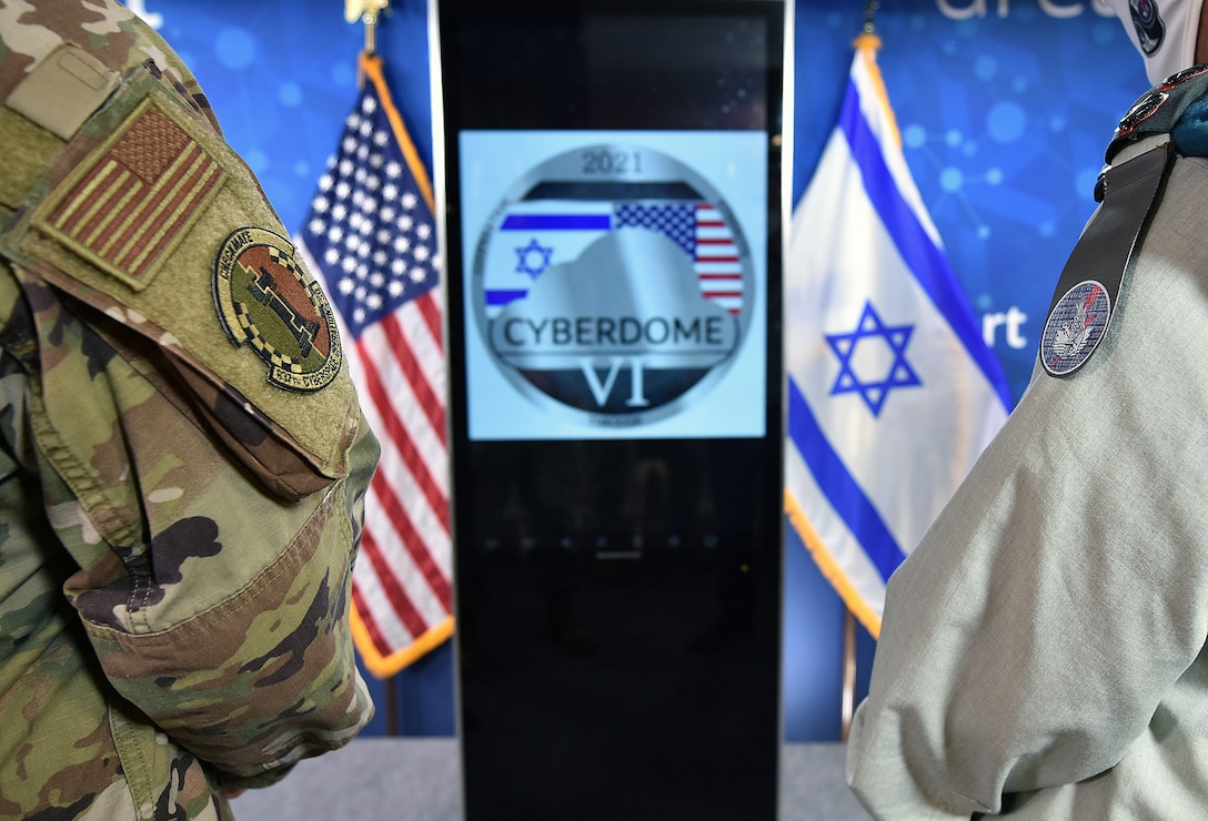 Israeli Maj. Gen. Lior Carmeli, (left) chief Joint Cyber Defense Directorate (JCDD), Israel Defense Forces, shakes hands with U.S. Army Maj. Gen. William J. Hartman (right), commander, Cyber National Mission Force, during the closing ceremonies of Cyber Dome VI. This week, Cyber Protection Teams from both JCDD and U.S. Cyber Command participated in Cyber Dome VI, a bilateral, hands-on-keyboard defensive cloud-based training exercise. The exercise brought together joint defensive cyber operators from the two countries and involved more than 75 participants. Cyber Dome VI enables joint defensive and integrated actions within the digital training environment, with CYBERCOM and JCDD operators jointly working as both blue forces and opposing forces.
