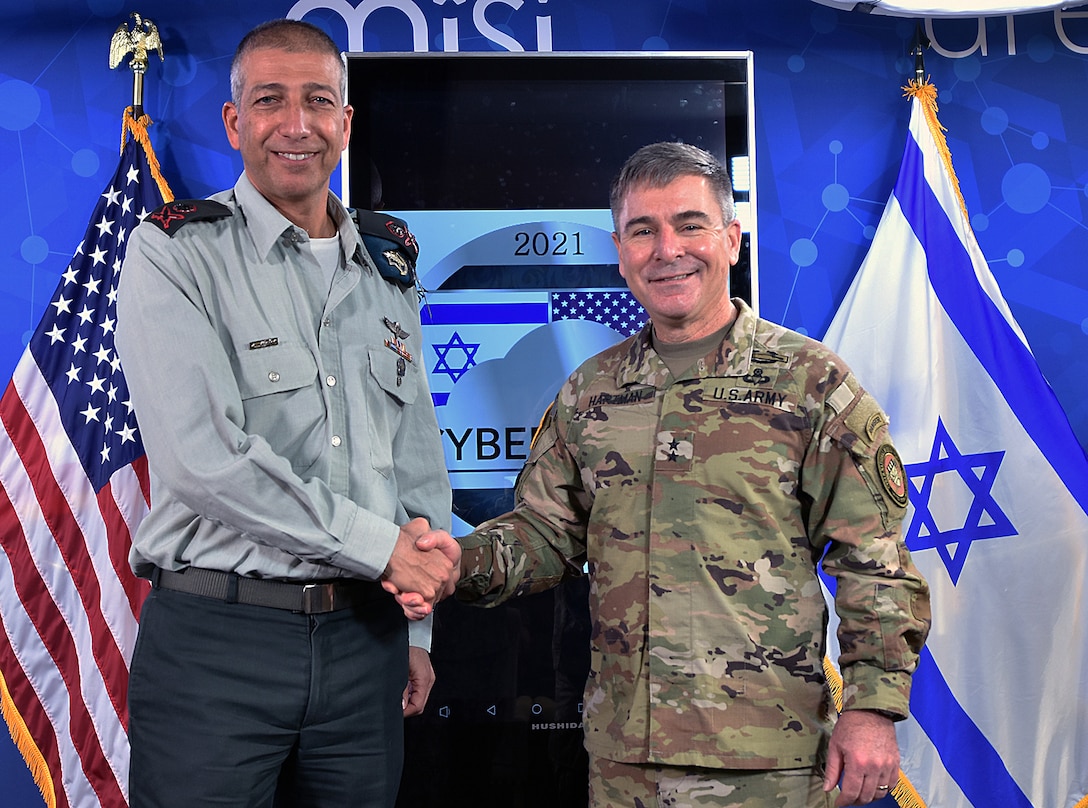 Israeli Maj. Gen. Lior Carmeli, (left) chief Joint Cyber Defense Directorate (JCDD), Israel Defense Forces, shakes hands with U.S. Army Maj. Gen. William J. Hartman (right), commander, Cyber National Mission Force, during the closing ceremonies of Cyber Dome VI. This week, Cyber Protection Teams from both JCDD and U.S. Cyber Command participated in Cyber Dome VI, a bilateral, hands-on-keyboard defensive cloud-based training exercise. The exercise brought together joint defensive cyber operators from the two countries and involved more than 75 participants. Cyber Dome VI enables joint defensive and integrated actions within the digital training environment, with CYBERCOM and JCDD operators jointly working as both blue forces and opposing forces.