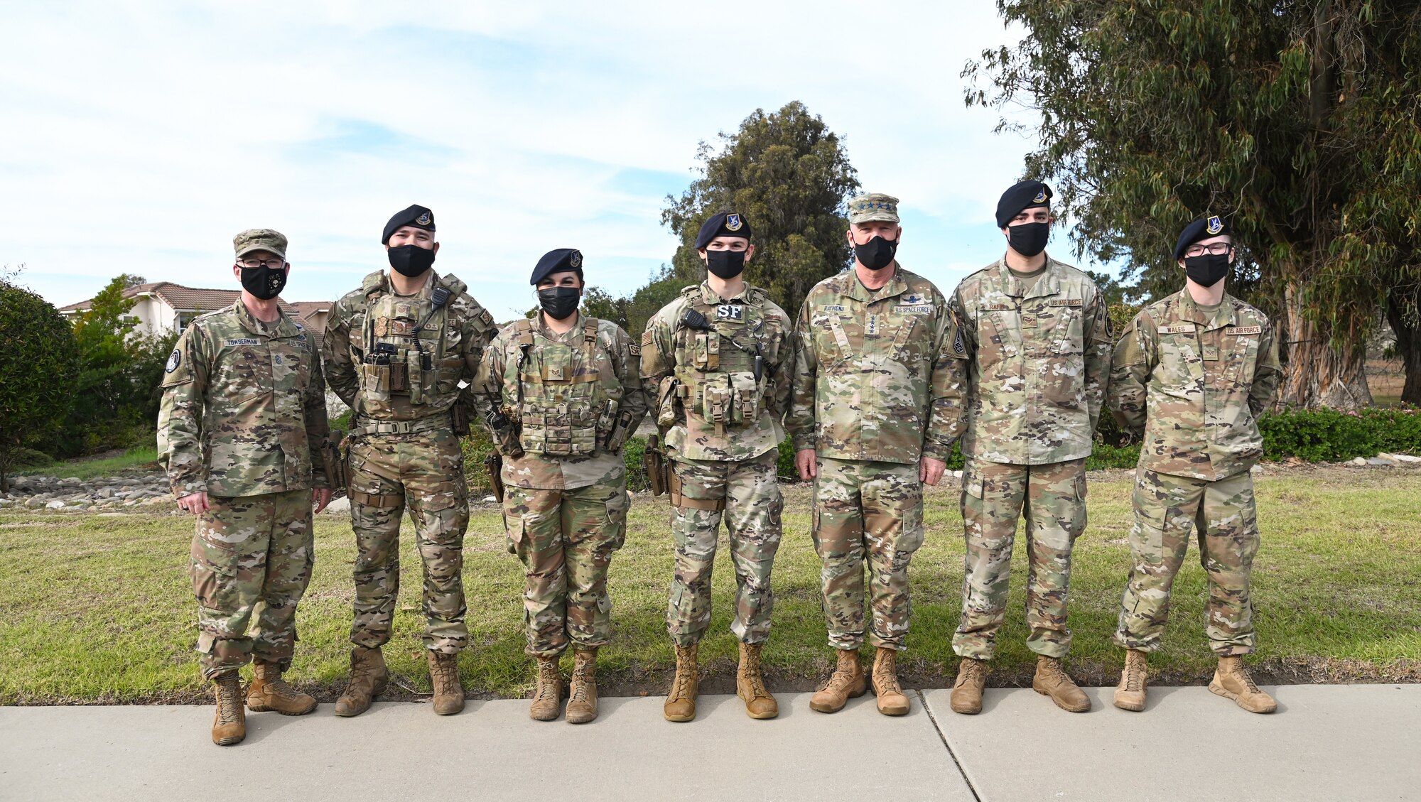 Chief of Space Operations Gen. John W. “Jay” Raymond and Chief Master Sergeant of the Space Force Roger A. Towberman, pose for a photo with members of the 30th Security Forces Squadron at Vandenberg Space Force Base, Dec. 21, 2021. Raymond and Towberman visited VSFB as part of their “Thank you” tour this week. (U.S. Space Force photo by Airman 1st Class Rocio Romo)