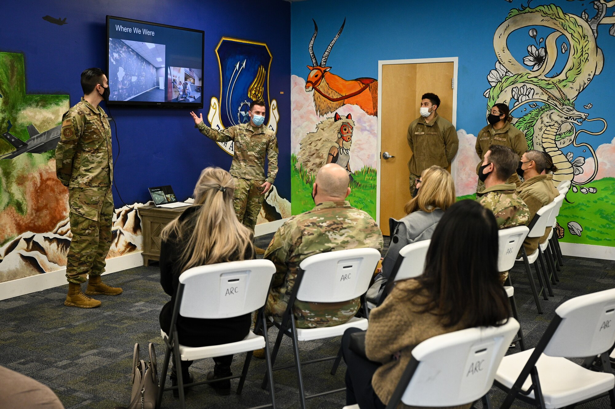 Airman 1st Class Gary Hugo (center), 367th Training Support Squadron, briefs Air Force Sustainment Center leaders about Airman Recreation Center renovations during a base tour.