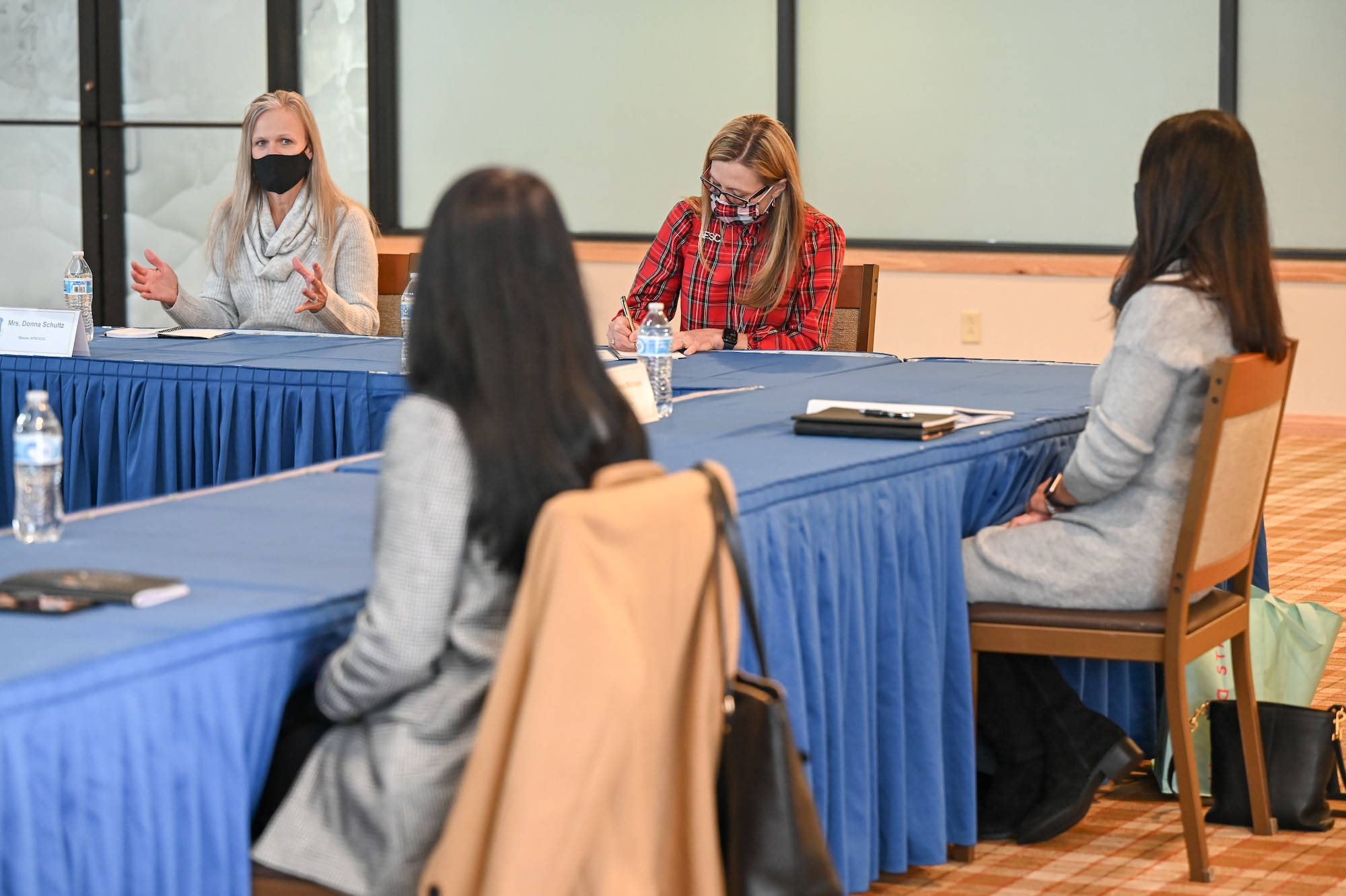 From left) Donna Schultz, spouse of Chief Master Sgt. Robert C. Schultz, Air Force Sustainment Center command chief, and Kim Miller, spouse of Lt. Gen. Tom D. Miller, AFSC commander, participate in a roundtable with base key spouses.