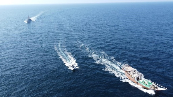 U.S. service members from patrol coastal ship USS Typhoon (PC 5) interdict a stateless fishing vessel carrying illicit weapons while transiting international waters in the North Arabian Sea, Dec. 20, 2021.