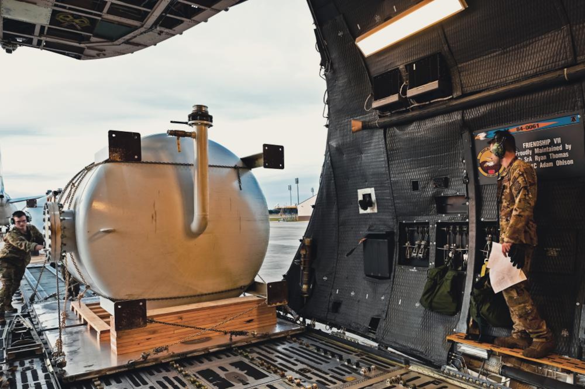 A water filtration tank is loaded onto a C-5M Super Galaxy.