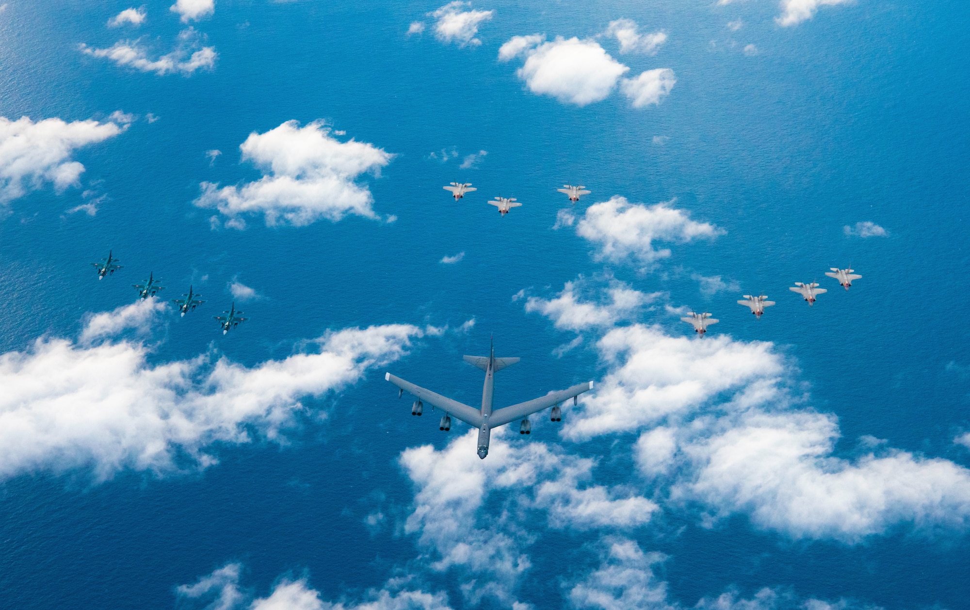 Four Japanese Air Self Defense Force F-2s (left), one B-52H Stratofortress (middle), four U.S. Air Force F-35A Lightning IIs (right), and three U.S. Air Force F-35A Lightning IIs (back) fly in formation during Operation Iron Dagger, Dec. 9, 2021. Operations like Iron Dagger allow military forces to be strategically predictable and operationally unpredictable in the Indo-Pacific Region by developing lethal, agile and resilient force posture and employment capabilities. (U.S. Air Force photo by Staff Sgt. Braden Anderson)