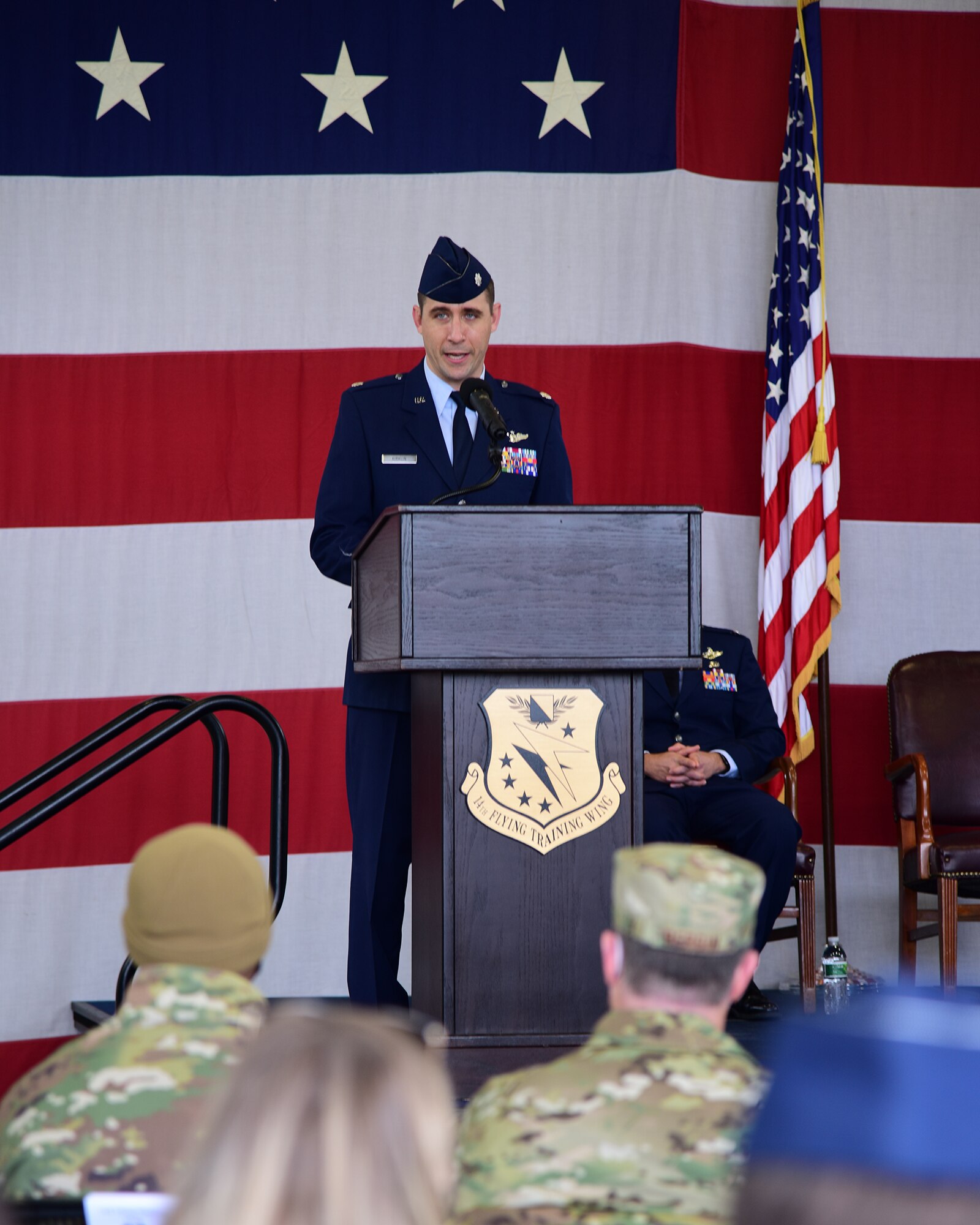 U.S. Air Force Lt. Col. Russell Kirklin, 41st Flying Training Squadron gaining commander, speaks at the change of command ceremony Dec. 20, 2021, on Columbus Air Force Base, Miss. The Air Force has a Permanent Change of Station cycle causing summers to have more ceremonies in comparison to the winter. (U.S. Air Force photo by Melissa Duncan-Doublin)