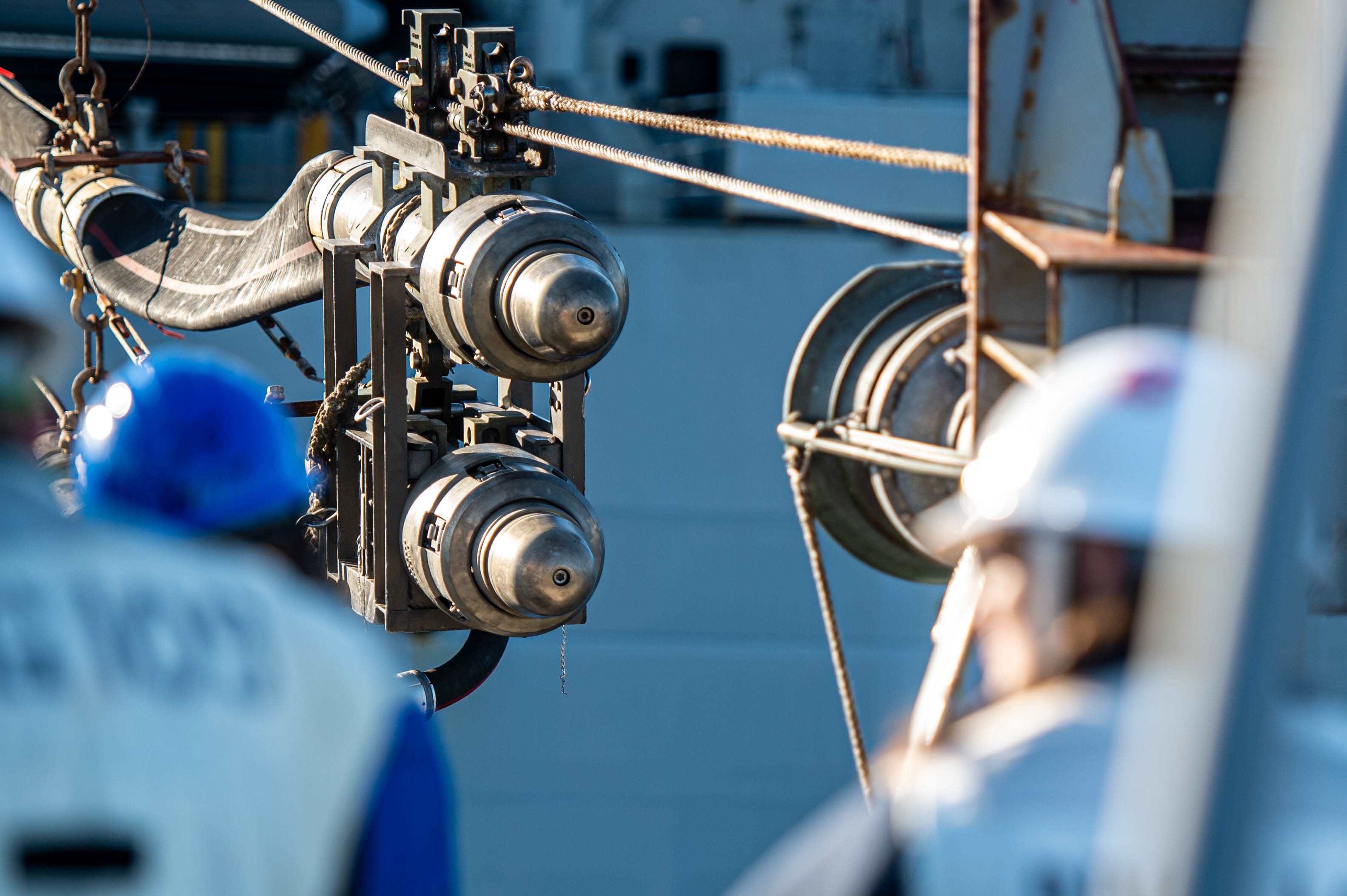 The Arleigh Burke-class guided-missile destroyer USS Jason Dunham (DDG 109) receives a probe from the Supply-class fast combat support ship USNS Supply (T-AOE-6) during a replenishment-at-sea, Dec. 19, 2021.