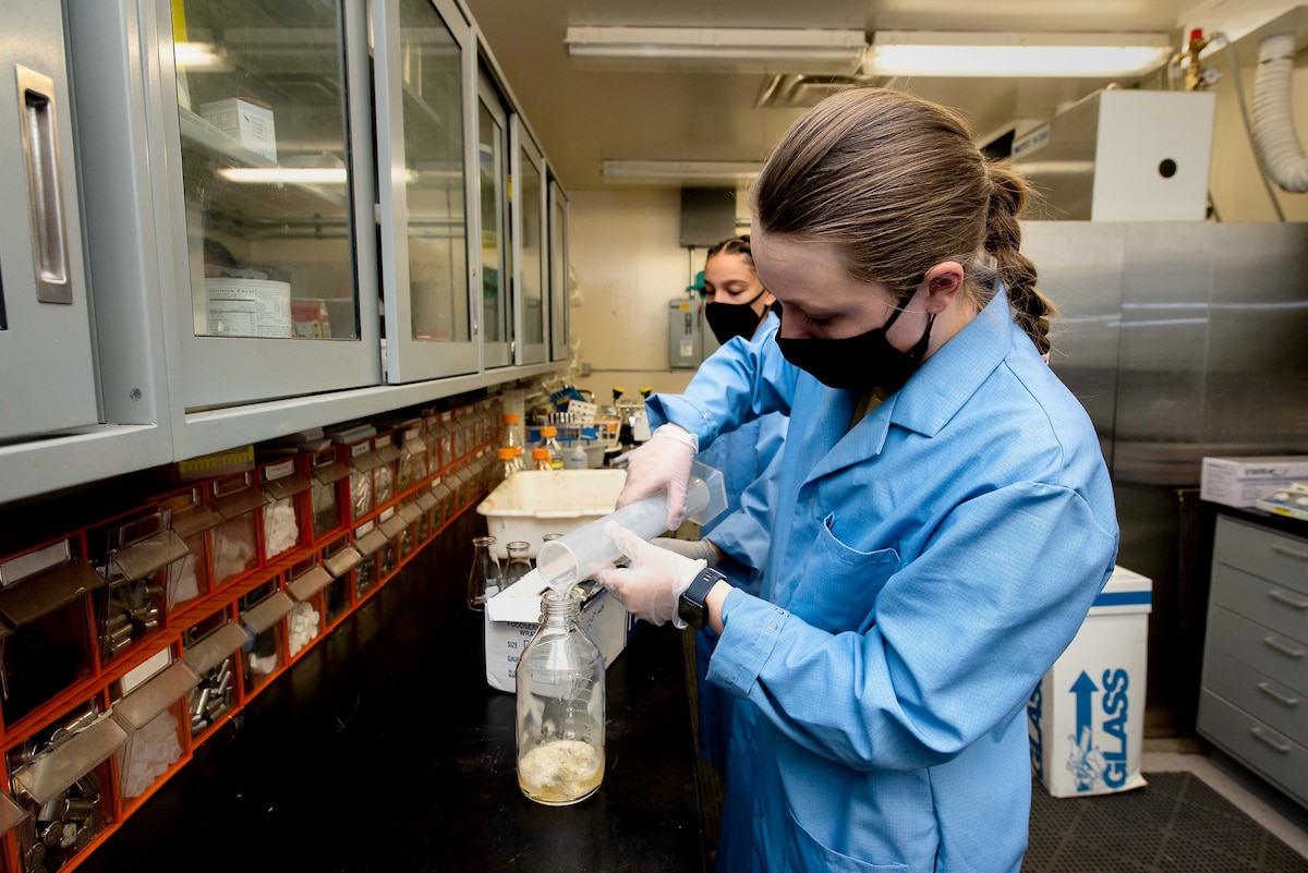 Air Force Academy C1C Alexandra Weisenburger makes bacterial growth media. Air Force Academy -- (U.S. Air Force photo/Trevor Cokley)