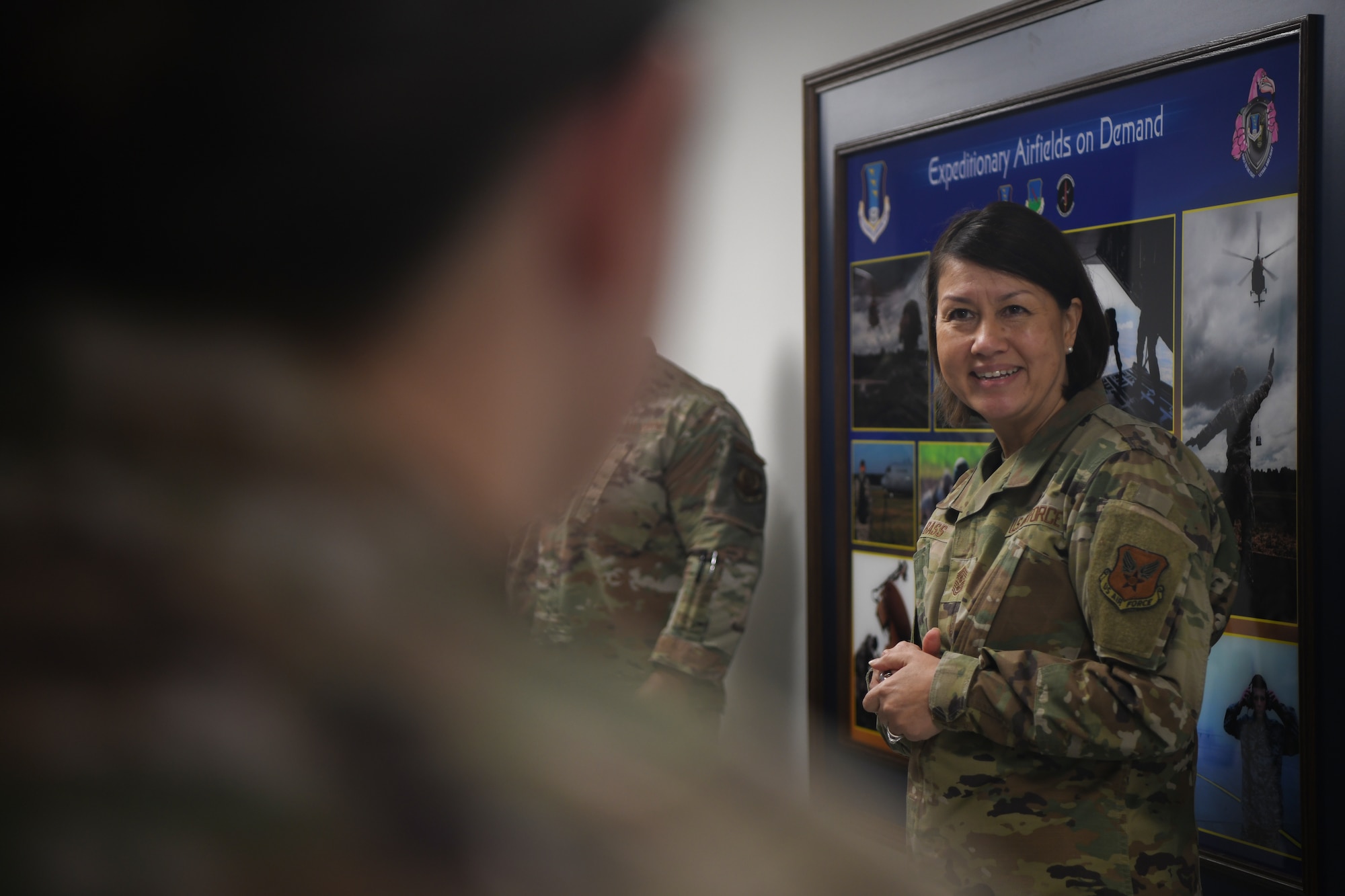 Chief Master Sgt. of the Air Force JoAnne S. Bass meets the 435th Air Expeditionary Wing (AEW) fly-away security team (FAST) at Ramstein Air Base, Germany, Dec. 19, 2021. The 435th AEW FAST provides aircraft security in support of contingencies, theater security operation events, humanitarian and civic assistance projects, expeditionary deployments. (U.S. Air Force photo by Senior Airman Ericka A. Woolever)