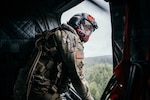 Washington National Guard Sgt. Nathan Smart, a member of B Company, 1st Battalion, 168th General Support Aviation, observes the water drop zone during water bucket training June 6, 2021, at Joint-Base Lewis McChord.