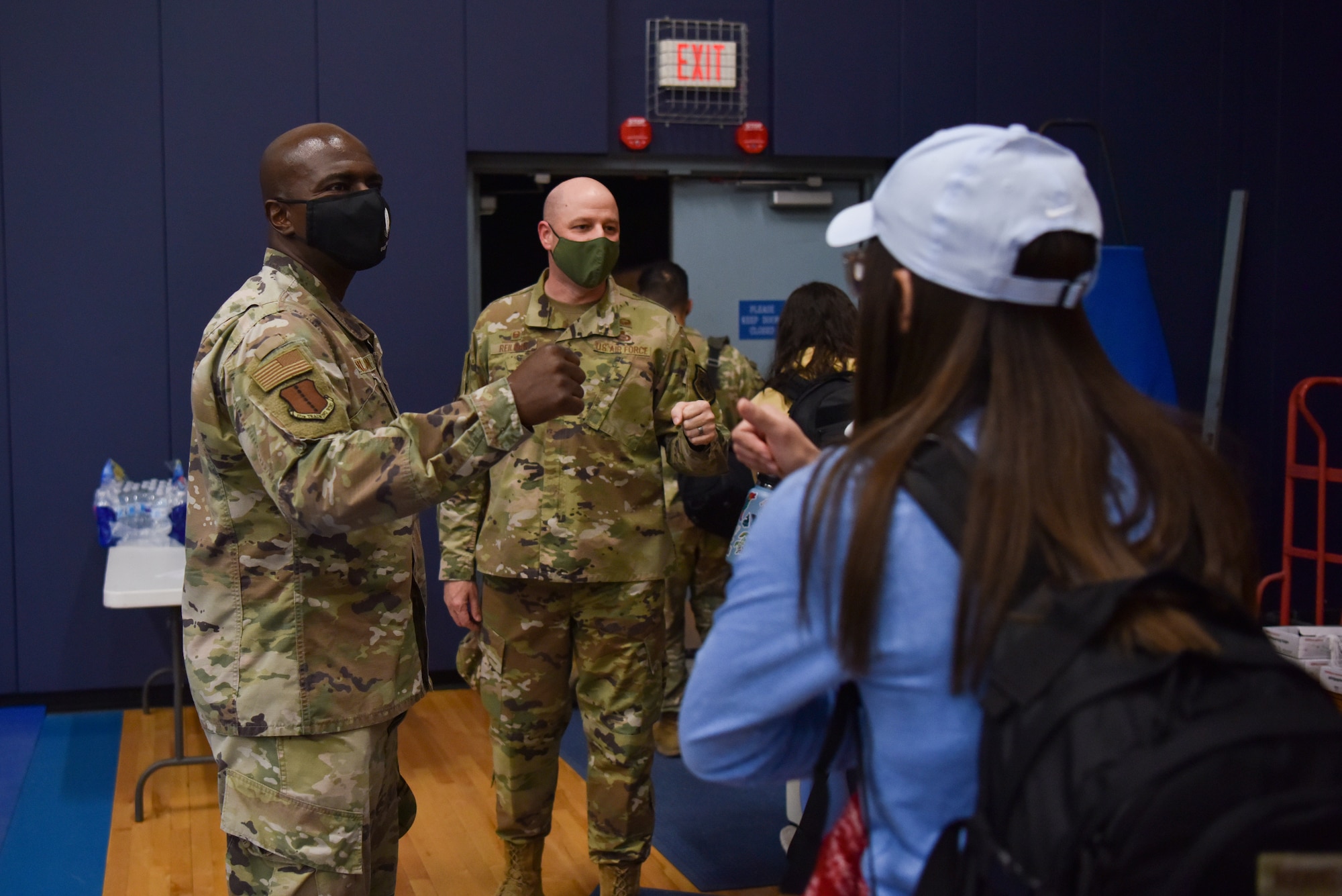 U.S. Air Force Col. Matthew Reilman, 17th Training Wing commander, and Col. James Finlayson, 17th TRW vice commander wish students a safe passage as they depart for Exodus at the Mathis Fitness Center on Goodfellow Air Force Base, Texas, Dec. 22, 2021. Exodus allows non-prior service Airmen to spend Christmas and New Years’ with their families and loved ones. (U.S. Air Force photo by Staff Sgt. Jermaine Ayers)