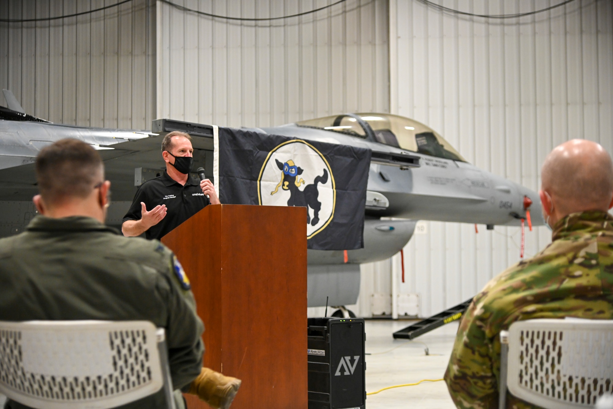 Tim Keating, 8th Aircraft Maintenance Unit site lead, gives opening remarks during the 8th AMU transition ceremony, Dec. 22, 2021, on Holloman Air Force Base, New Mexico. Civilian contractors took over 8th AMU maintenance responsibilities in 2017 following the reactivation of the 8th Fighter Squadron; the 8th AMU is now manned by active duty Airmen. (U.S. Air Force photo Airman 1st Class Jessica Sanchez-Chen)