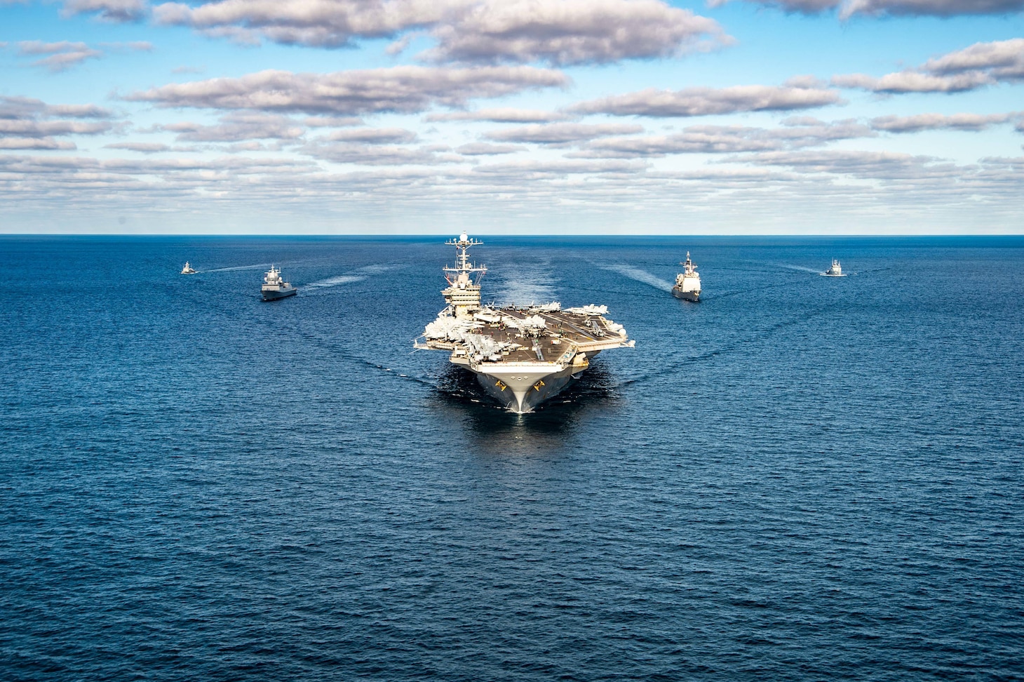 The Nimitz-class aircraft carrier USS Harry S. Truman (CVN 75), the Ticonderoga-class guided missile cruiser USS San Jacinto (CG 56), and the Royal Norwegian Navy Frigate HNoMS Fridtjof Nansen (F310) participate in a passing exercise with the Tunisian offshore patrol vessel Hannon (P612) and La Combatante III class fast patrol boat Tunis (502) in the Mediterranean Sea, Dec. 20, 2021.