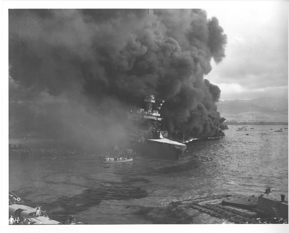 Original caption: The USS California (BB44) after the Japanese attack on Pearl Harbor, Dec. 7 1941. Abandoning ship. Photo courtesy of the U.S. National Archives and Records Administration.