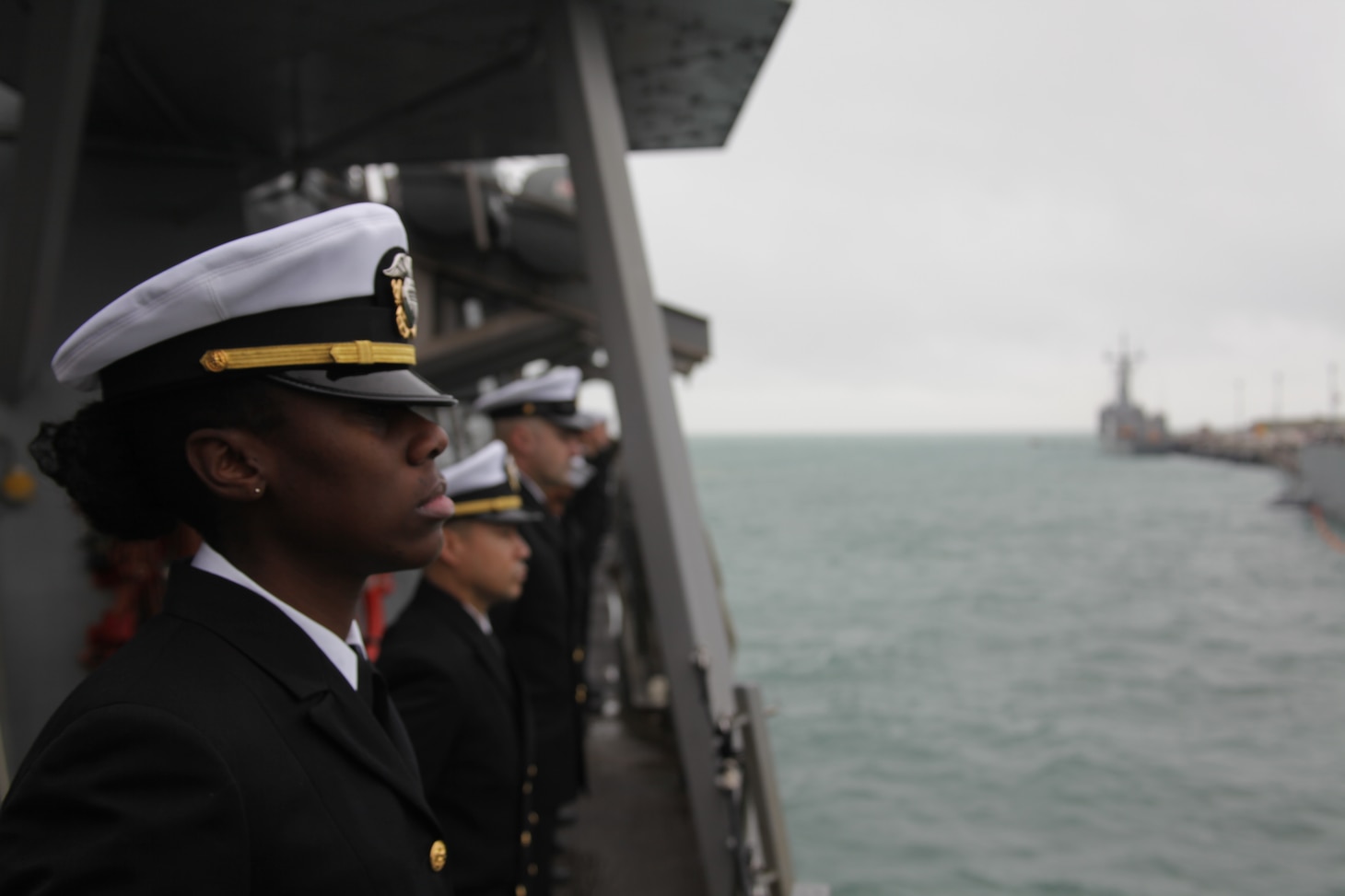 Ensign Crystal Barnes mans the rails as the Arleigh Burke-class guided missile destroyer USS Arleigh Burke (DDG 51) returned to Rota, Spain, Dec. 23, 2021, completing her inaugural patrol as a member of the U.S. Navy’s Forward Deployed Naval Forces-Europe (FDNF-E). Arleigh Burke, forward-deployed to Rota, Spain, is on its first patrol in the U.S. Sixth Fleet area of operations in support of U.S. National Security Interests and regional allies and partners.