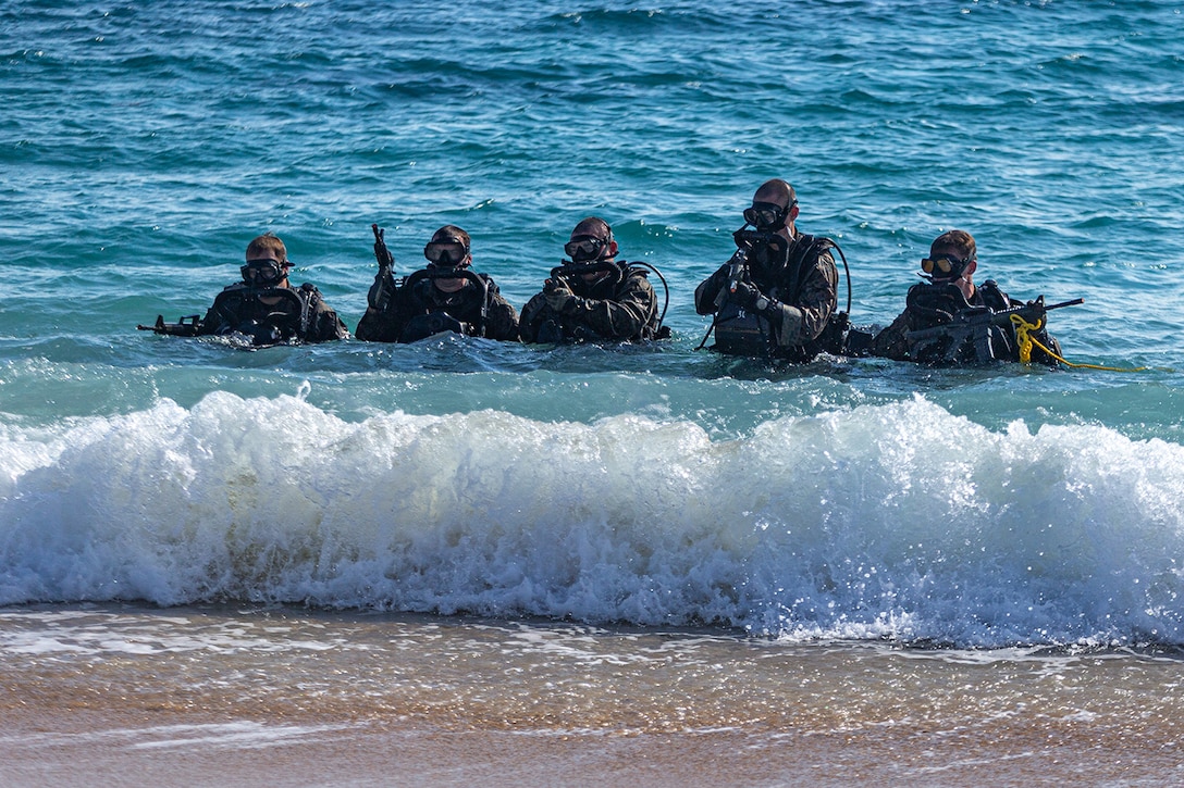 U.S. Marines with Force Reconnaissance Platoon, 31st Marine Expeditionary Unit, egress from the bay after dive operations during MEU exercise on Kin Blue training area, Okinawa, Japan, Dec. 15, 2021. FRP conducted diving repetitions to maintain proficiency and currency as combatant divers. MEUEX is a pre-deployment training exercise that validates and reinforces the MEUs mission capabilities across all of the Marine subordinate elements. The 31st MEU, the Marine Corps only continuously forward-deployed MEU, provides a flexible and lethal force ready to perform a wide range of military operations as the premier crisis response force in the Indo-Pacific region.