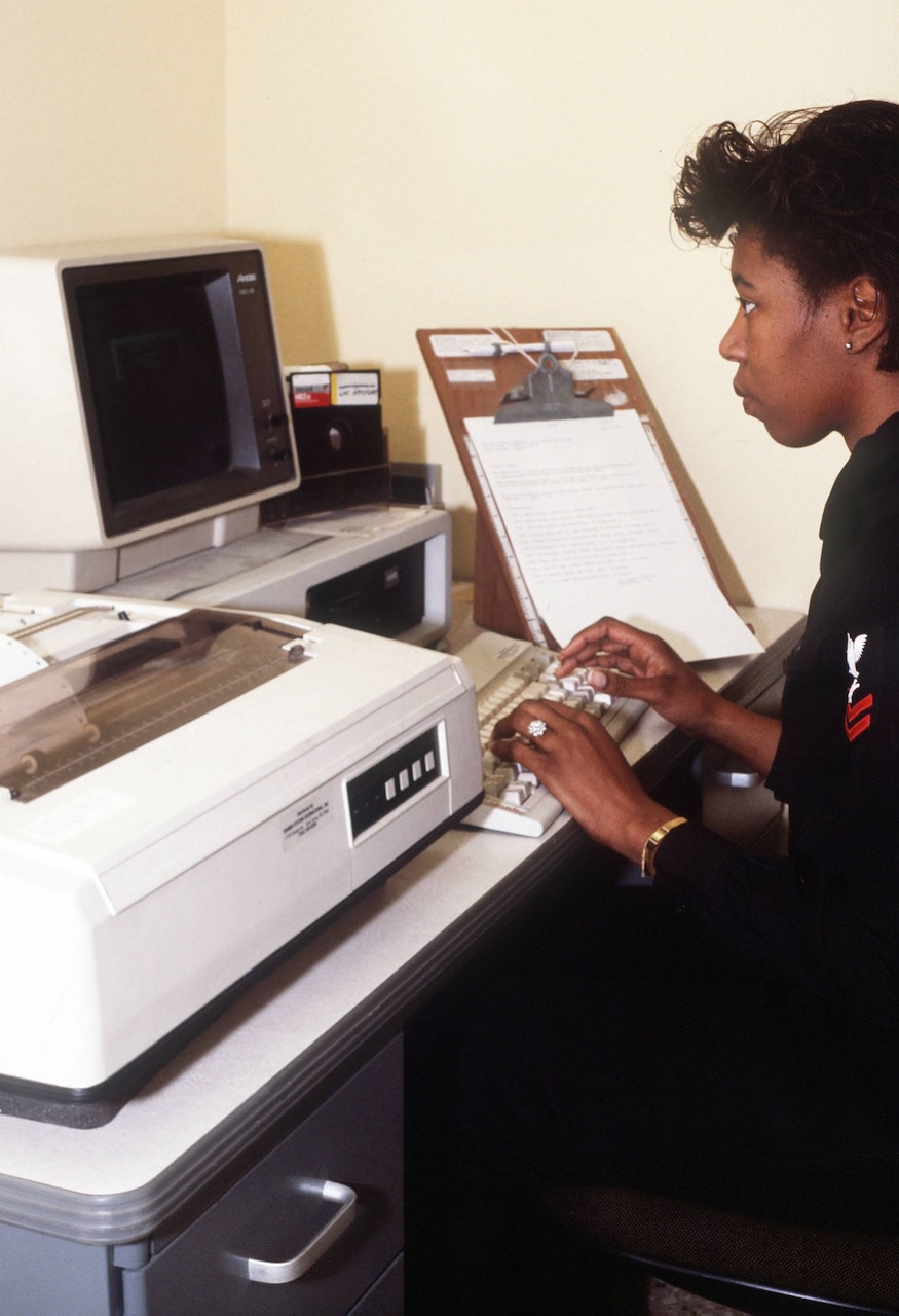 Legalman 2nd Class Terri L. Watson-Mionus, paralegal secretary for the Naval Legal Service Office detachment, works on a Columbia word processor.