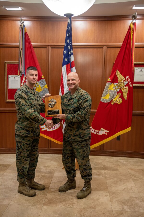 Master Sgt. Michael Murphy, equal opportunity advisor for Marine Forces Reserve, is awarded the Equal Opportunity Advisor of the Year award by Lt. Gen. David G. Bellon, Commander of Marine Forces Reserve and Marine Forces South, at Marine Corps Support Facility New Orleans, Dec. 20, 2021. On Oct. 15, 2021, a selection board convened to consider nominees with exemplary records that demonstrated a consistently high level of performance that significantly and positively impacted their commands’ Equal Opportunity programs. (U.S. Marine Corps photo by Lance Cpl. Mitchell Collyer)