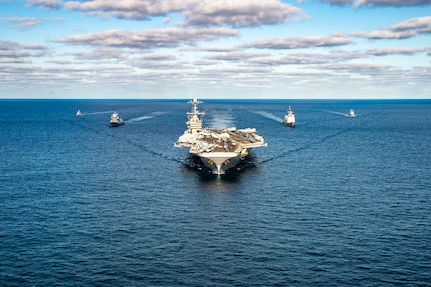 The Nimitz-class aircraft carrier USS Harry S. Truman (CVN 75), the Ticonderoga-class guided missile cruiser USS San Jacinto (CG 56), and the Royal Norwegian Navy Frigate HNoMS Fridtjof Nansen (F310) participate in a passing exercise with the Tunisian offshore patrol vessel Hannon (P612) and La Combatante III class fast patrol boat Tunis (502) in the Mediterranean Sea, Dec. 20, 2021.