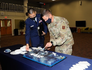 Two Airmen cut USSF 2nd birthday cake at JBSA-Lackland