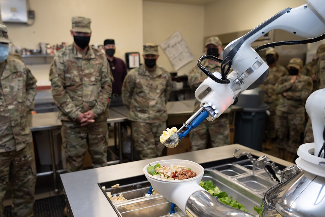 a food robot preparing food