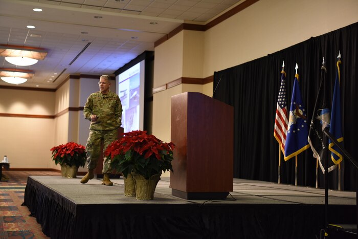 Image of an Airman speaking on a stage.