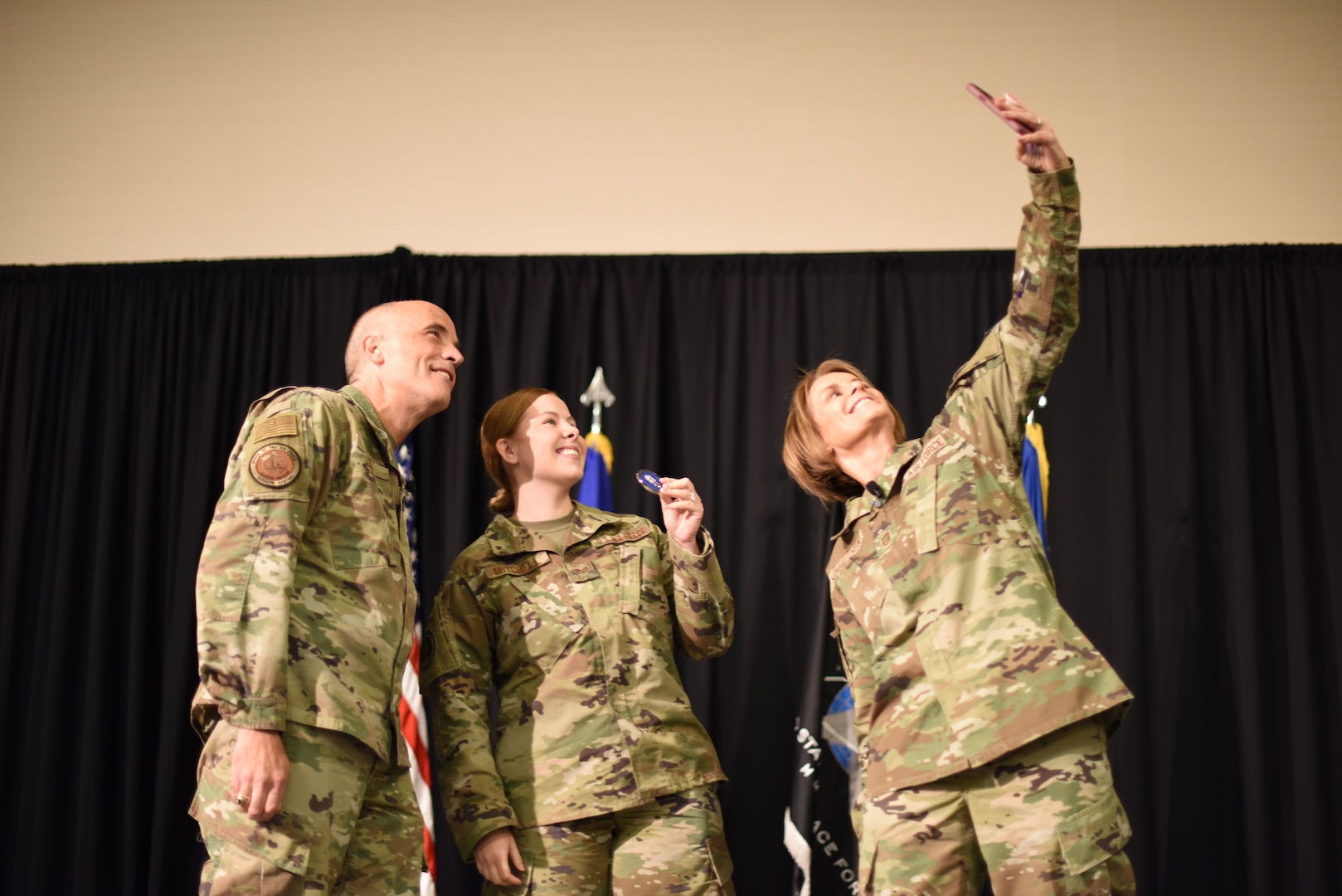 Image of Airmen taking a photo.