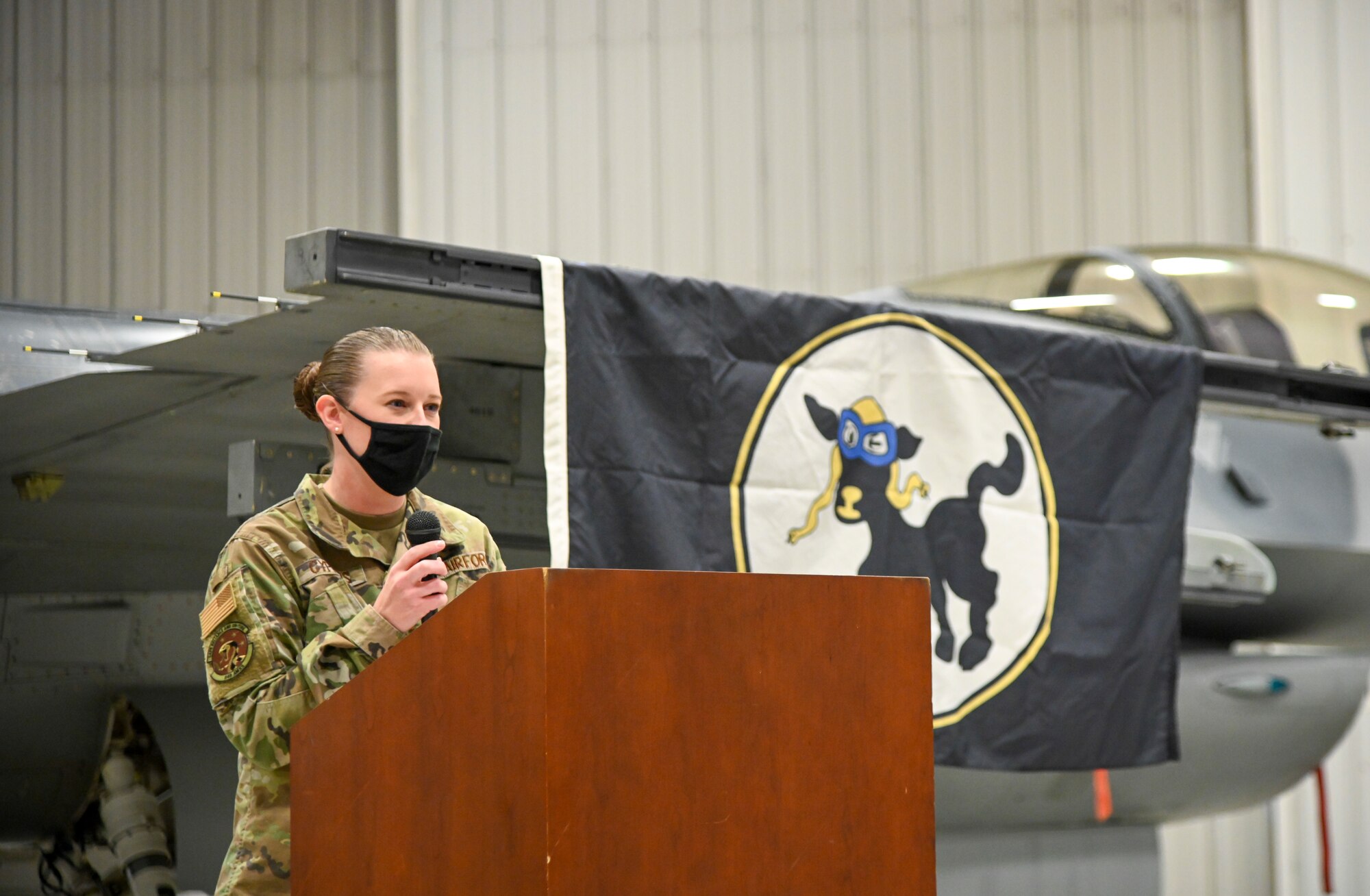 Capt. Amanda Cyphers, 8th Aircraft Maintenance Unit officer in charge, gives closing remarks during the 8th AMU transition ceremony, Dec. 22, 2021, on Holloman Air Force Base, New Mexico. The addition of over 200 8th AMU positions, and 28 additional F-16 Vipers makes the 849th Aircraft Maintenance Squadron the largest F-16 maintenance squadron in the Air Force. (U.S. Air Force photo by Airman 1st Class Jessica Sanchez-Chen)