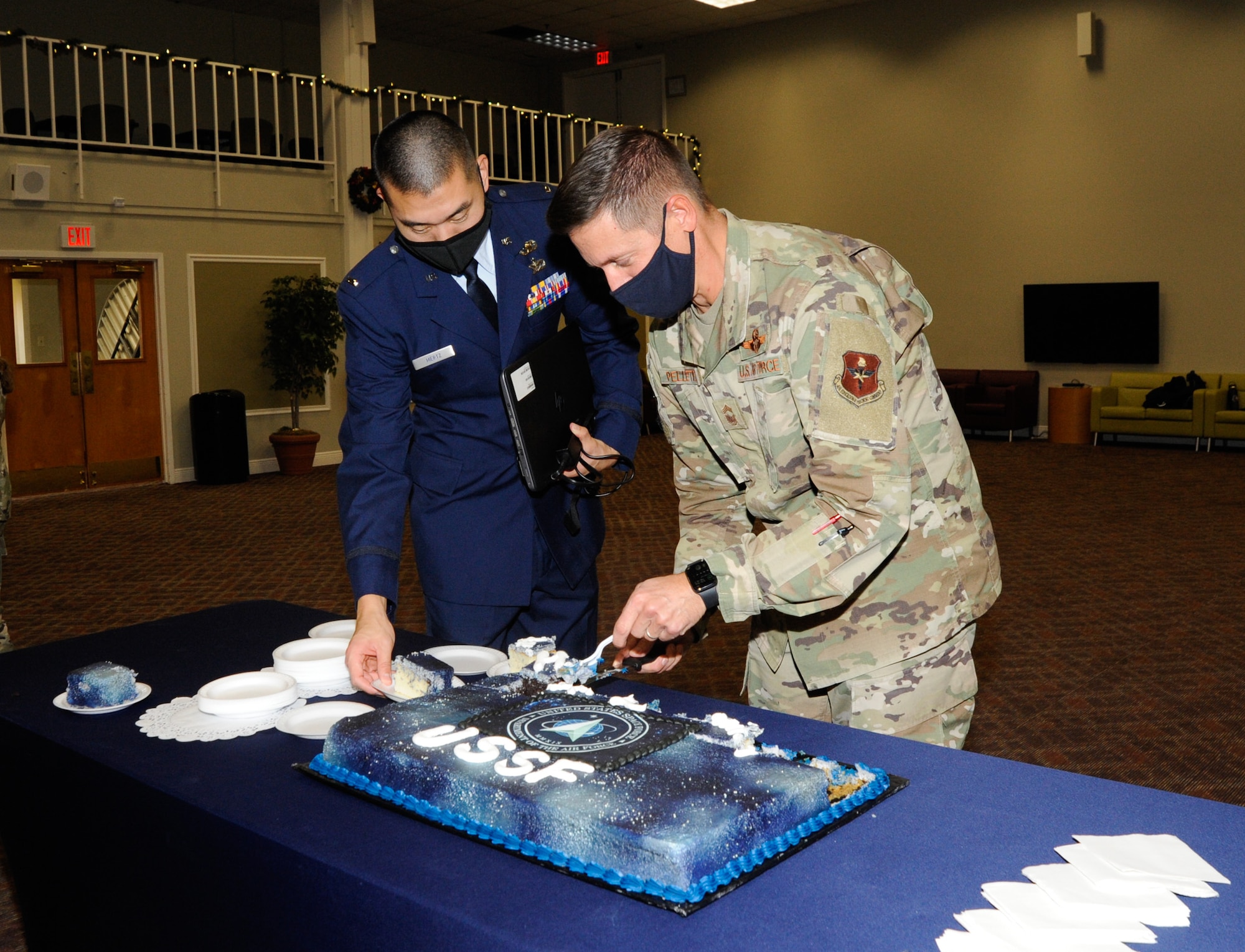 Two Airmen cut USSF 2nd birthday cake at JBSA-Lackland
