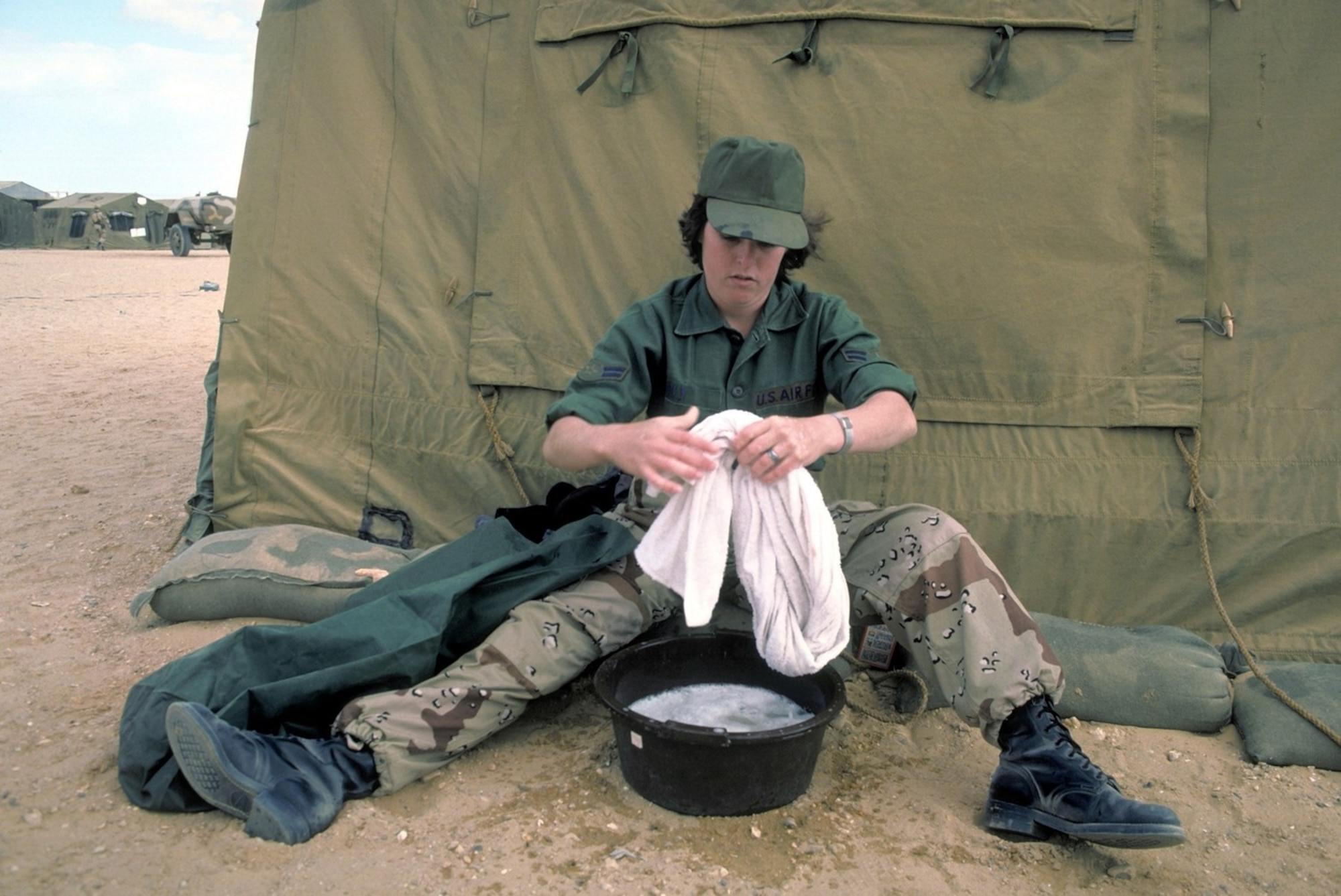 An Airman First Class does her laundry during exercise BRIGHT STAR 82. (Photo courtesy National Archives)