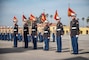 New U.S. Marines with Hotel Company, 2nd Recruit Training Battalion, stand at attention before giving the guidons to their drill instructors during a graduation ceremony at Marine Corps Recruit Depot, San Diego, Dec. 22, 2021.