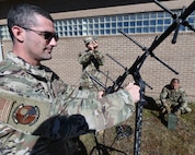 Cyber commandos set-up and align the angle of an antenna to a satellite