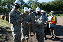 Rear Adm. John Korka, Commander, Naval Facilities Engineering Systems Command (NAVFAC), and Chief of Civil Engineers, points toward the Red Hill Bulk Fuel Storage Facility during a site visit.