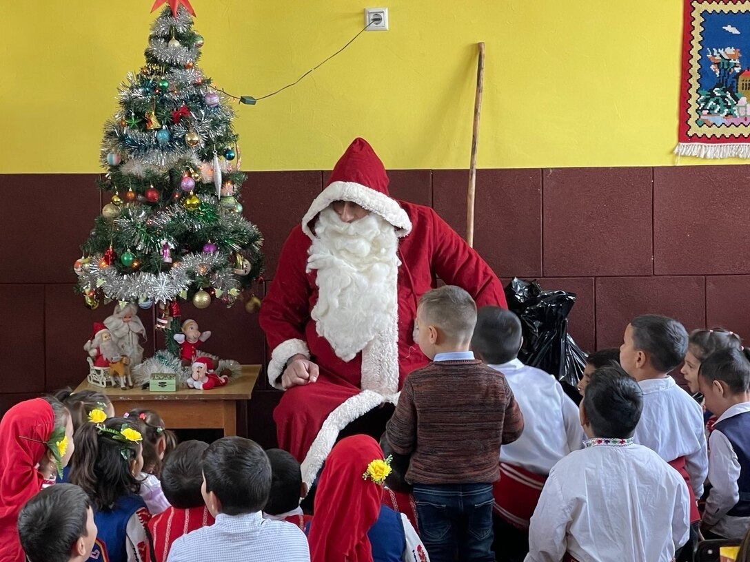 Santa asks the children how they behaved throughout the year before giving them gifts, December 22, 2021.