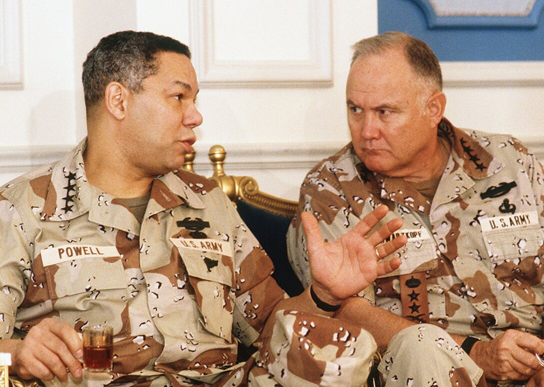 General Powell and General Norman H. Schwarzkopf, commander-in-chief, U.S. Central Command, discuss coalition activities during Operation Desert Shield (DOD/H.H. Deffner)