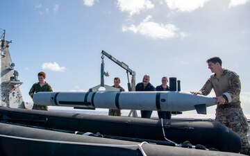 Sailors aboard USS Charleston (LCS 18) transport a simulated Mark 18 Mod 2 Kingfish during a mine countermeasures exercise.