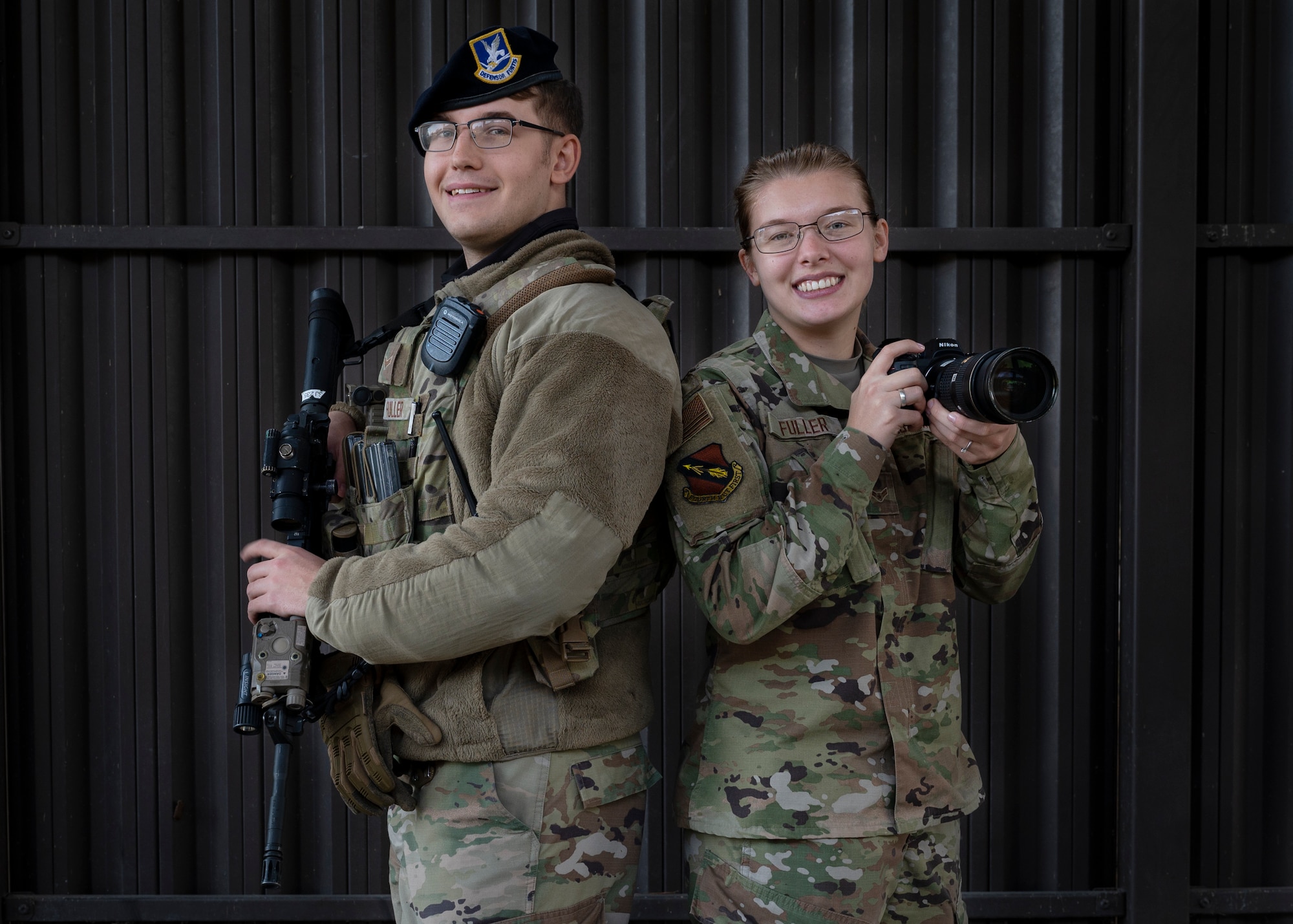 Airmen 1st Class Sven Fuller, 4th Security Forces Squadron entry controller, and Sabrina Fuller, 4th Fighter Wing public affairs specialist, pose for a photo at Seymour Johnson Air Force Base, North Carolina, Dec. 7, 2021.