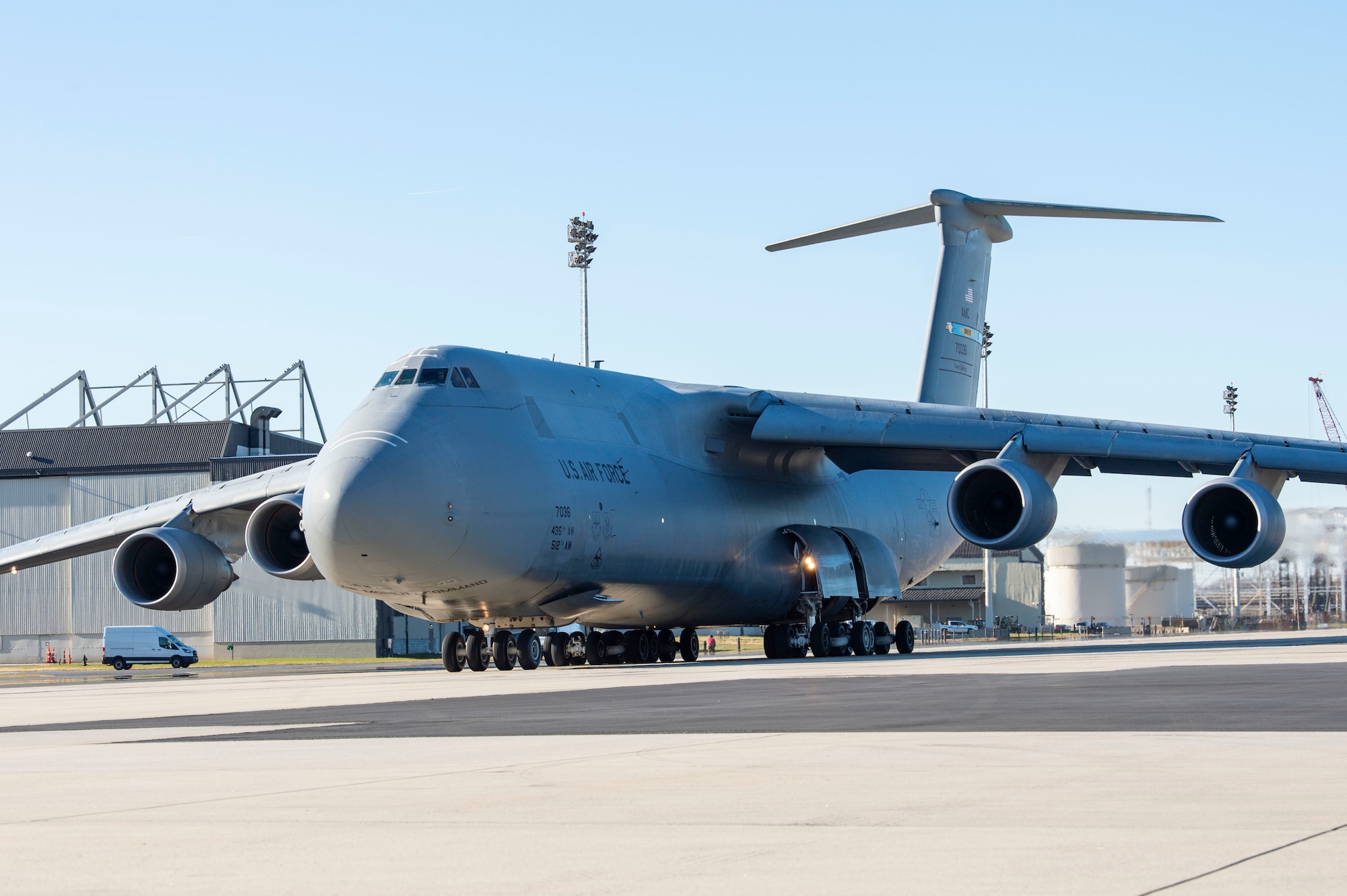 A C-5M Super Galaxy taxis down the flight line prior to takeoff at Dover Air Force Base, Delaware, Dec. 20, 2021. Eighteen C-5M’s are assigned to Dover AFB, along with 13 C-17 Globemaster IIIs that provide 20 percent of the nation’s outsized airlift capacity. (U.S. Air Force photo by Roland Balik)