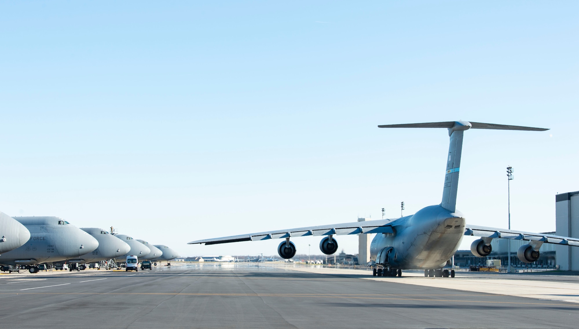 A C-5M Super Galaxy taxis down the flight line prior to takeoff at Dover Air Force Base, Delaware, Dec. 20, 2021. Eighteen C-5M’s are assigned to Dover AFB, along with 13 C-17 Globemaster IIIs that provide 20 percent of the nation’s outsized airlift capacity. (U.S. Air Force photo by Roland Balik)