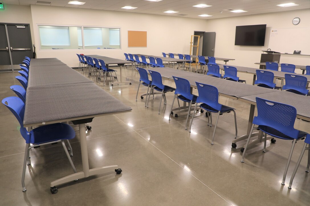 Workstation with protective mats for weapon training, cleaning, and assembling in the new indoor firing range at Minot Air Force Base, North Dakota, December 15, 2021.