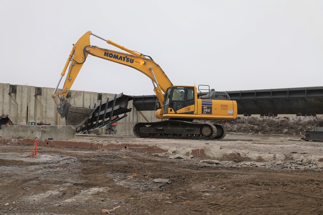 U.S. Army Corps of Engineers, Omaha District contractors demolish and move steel from the old firing range facility. Minot Air Force Base, North Dakota, December 15, 2021