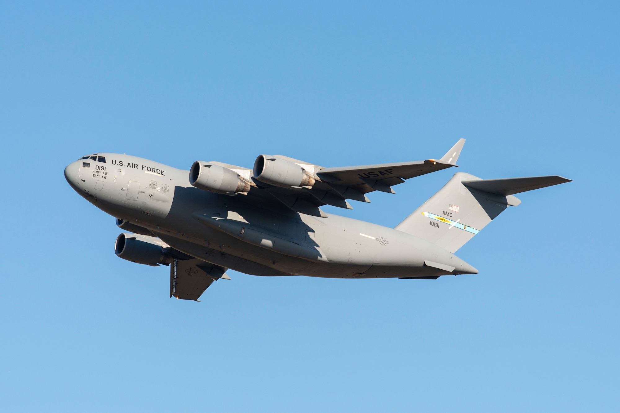 A C-17 Globemaster III completes a touch and go landing during a local training flight at Dover Air Force Base, Delaware, Dec. 20, 2021. Thirteen C-17s are assigned to Dover AFB, along with 18 C-5Ms that provide 20 percent of the nation's outsized airlift capacity. (U.S. Air Force photo by Roland Balik)