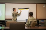 Maj. Bridget Flannery comes to Wyoming to train Soldiers to become Buddy Aid trainers at Joint Force Headquarters in Cheyenne, Wyo. on Dec. 6, 2021.