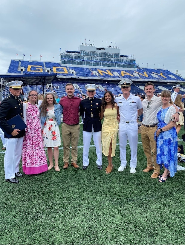 The family of retired Marine Corps Brigadier Gen. Frank Kelley poses for a picture at 2nd Lt. Paul Kelley's commissioning ceremony at the U.S. Naval Academy, Annapolis, Md. They had their challenges associated with the sudden increase in size and military demands but overcame all obstacles together as a family. (Courtesy Photo)