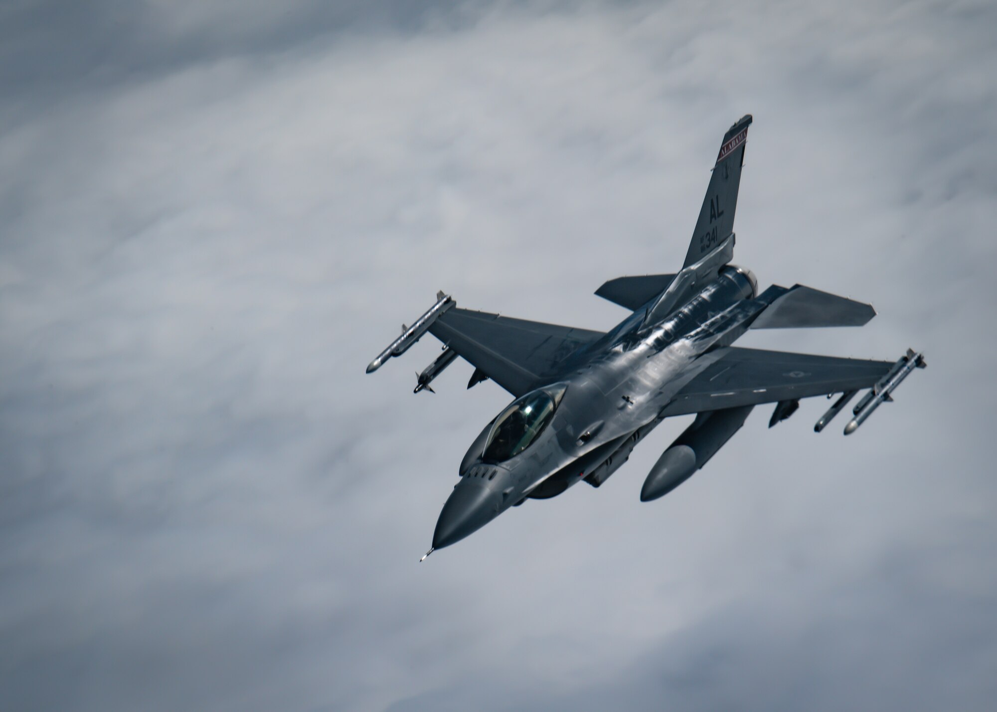 An F-16 Fighting Falcon aircraft assigned to the 187th Fighter Wing, Alabama National Guard, soars through the sky during a refueling exercise over Alabama, Dec. 21, 2021.