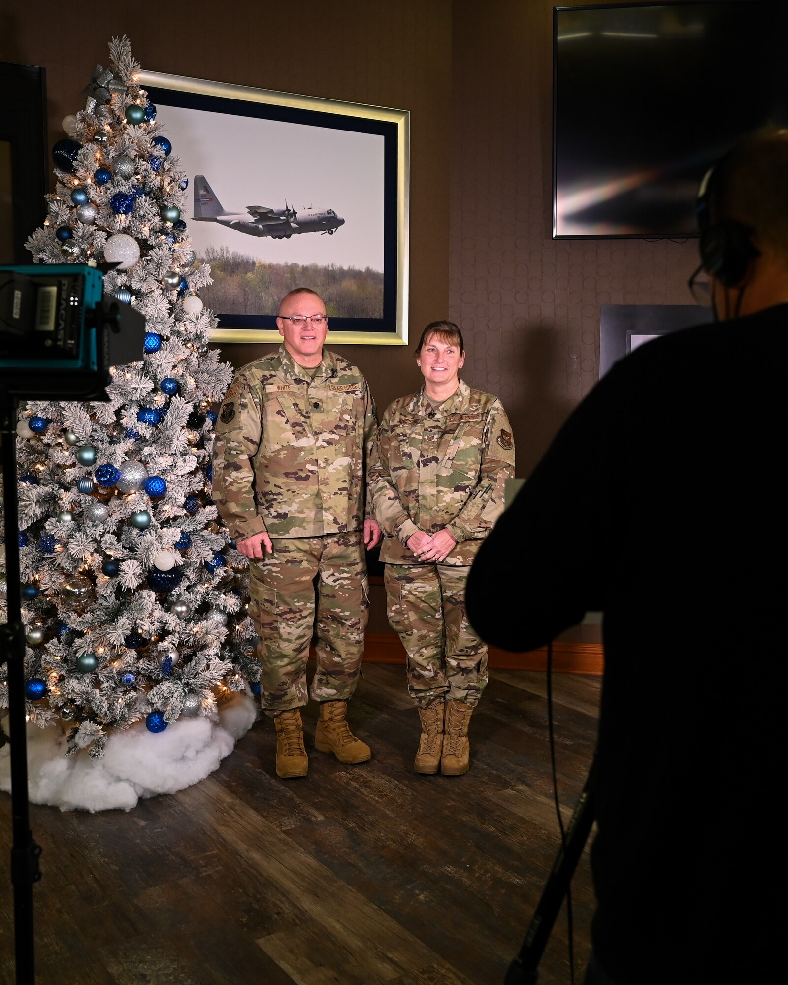 Lt. Col. Dominic White, an operations officer assigned to the 910th Force Support Squadron, and his wife, Tech. Sgt. Deborah White, a support staff member with the 910th Mission Support Group, give a holiday greeting to their friends, family and local community, Dec. 5, 2021, at Youngstown Air Reserve Station’s Community Activity Center.